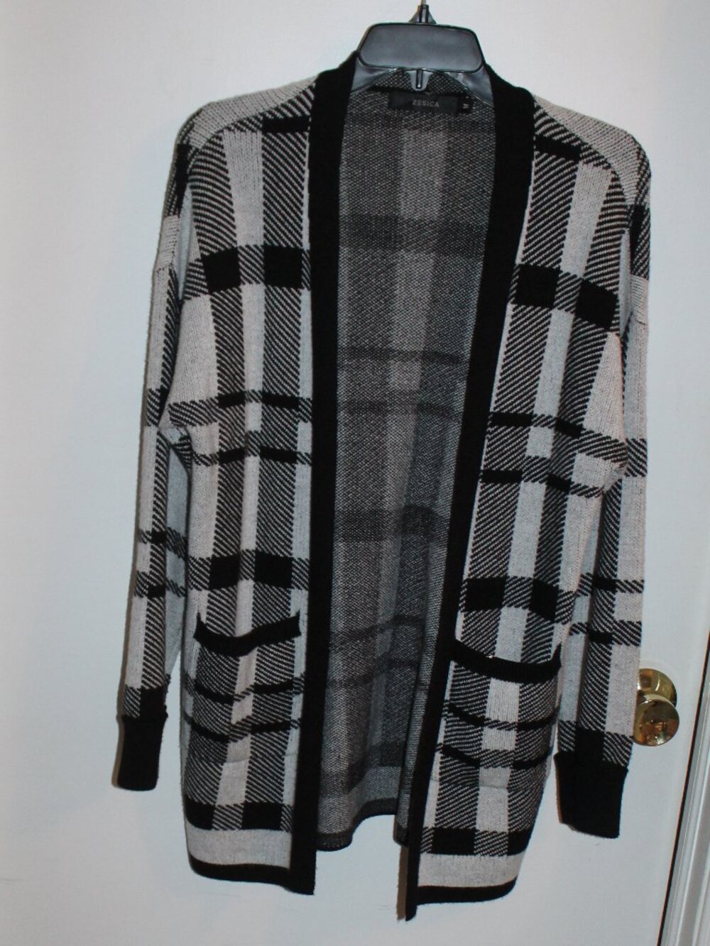 Zesica black & white plaid open-front cardigan w/front pockets and long sleeves.